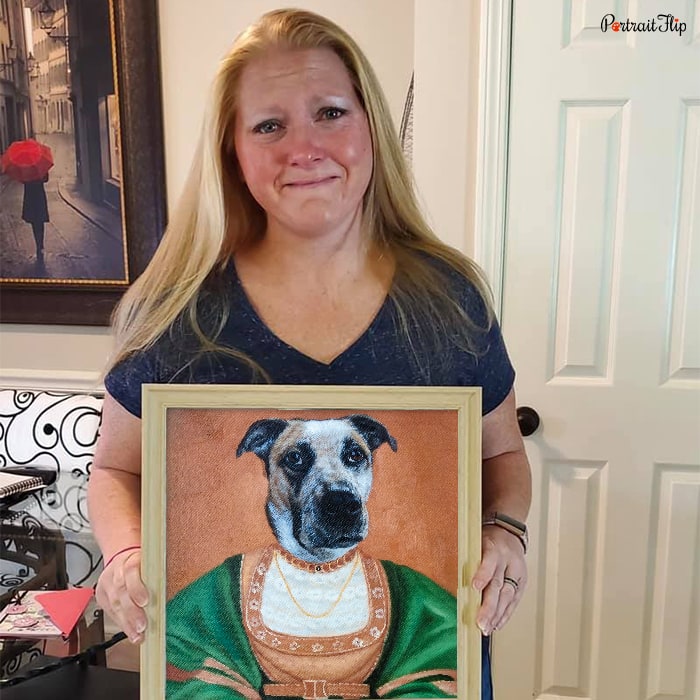 Happy customer posing with their royal pet portrait