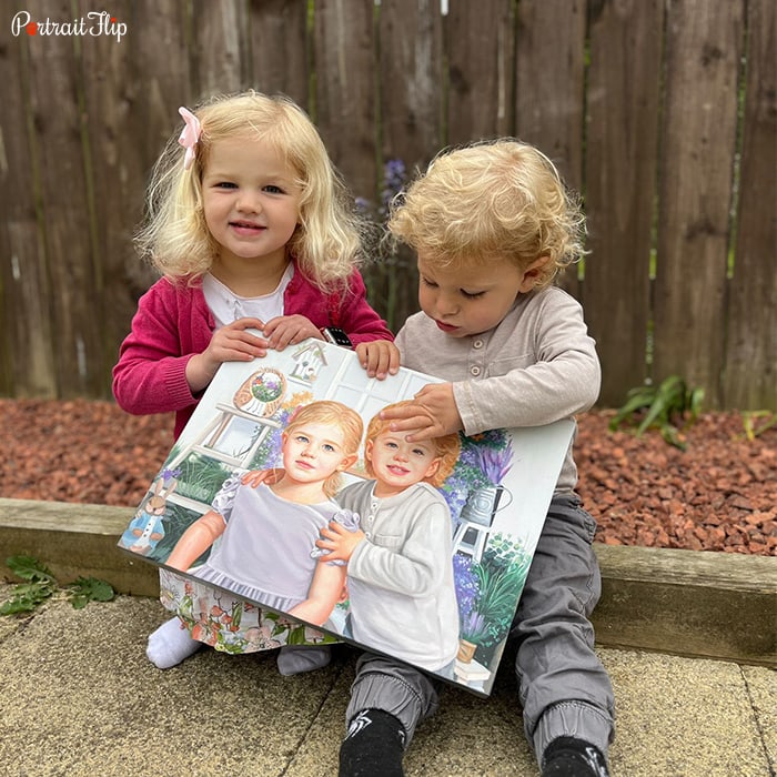 Picture of two children holding child portraits that include their picture